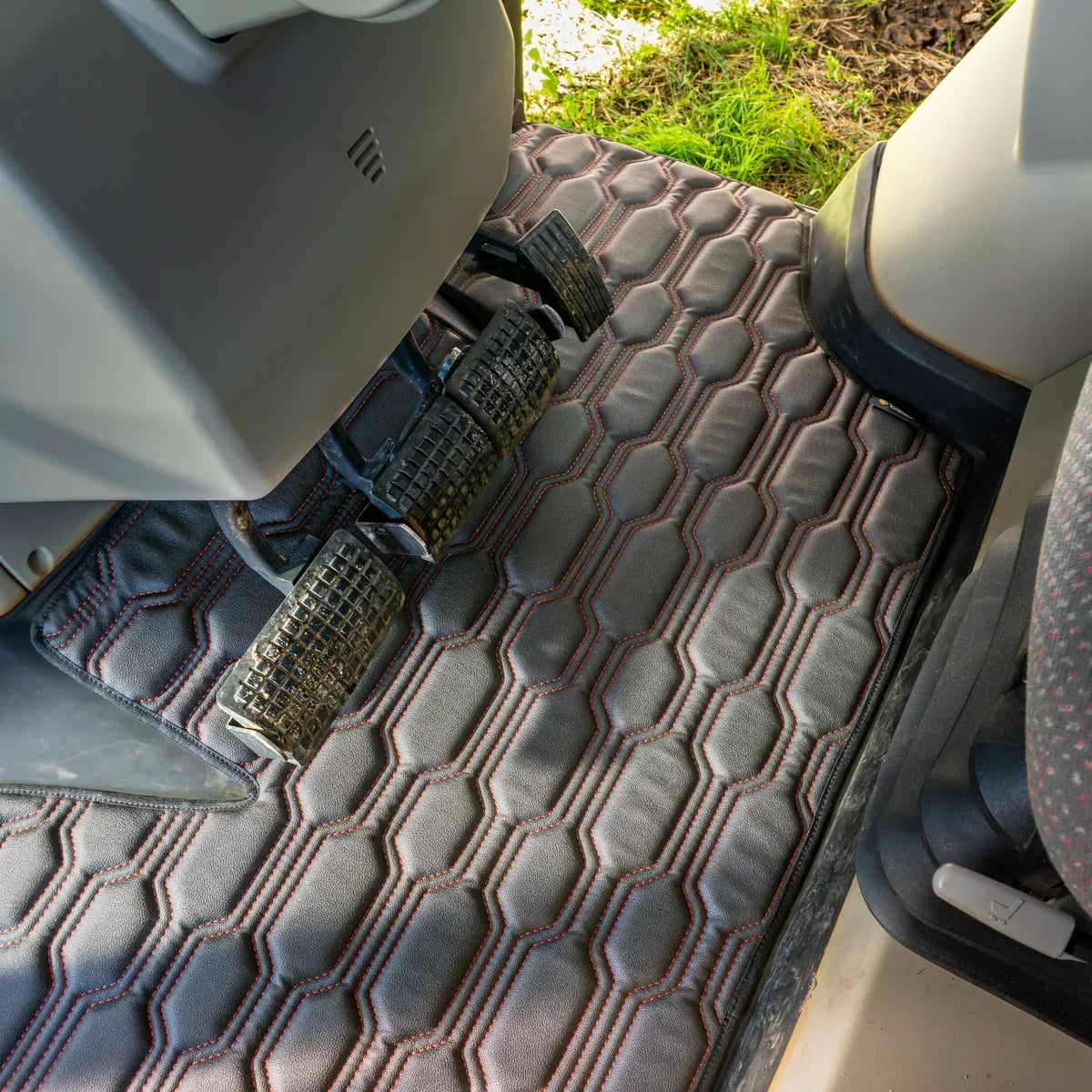 CabMat floor mat installed in Massey Ferguson cab – detail 1